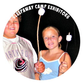 Boy and a girl roasting marshmallows at summer camp
